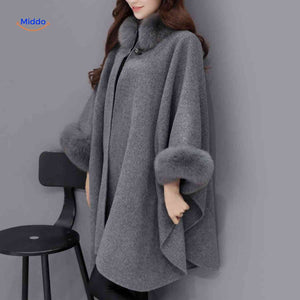 Furina wool cape coat in gray with elegant faux-fur collar trim and comfortable fit.