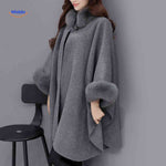 Furina wool cape coat in gray with elegant faux-fur collar trim and comfortable fit.