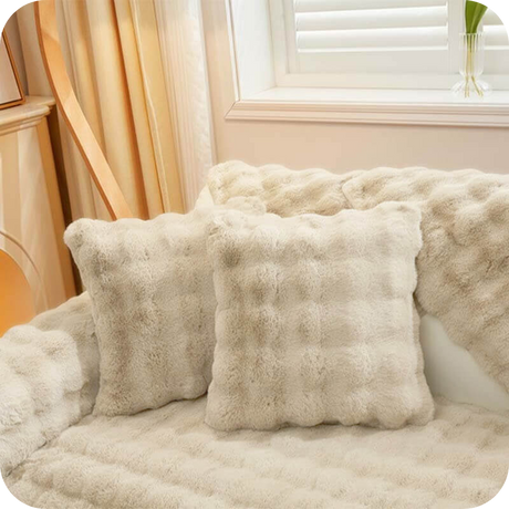 Complete white plush bundle with sofa covers, pillows and blanket for cozy living.
