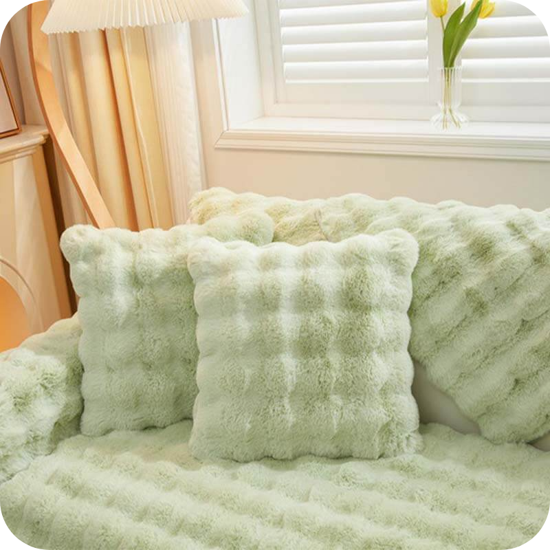Green luxury plush covers with non-slip backing technology for secure furniture protection.