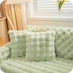 Green luxury plush covers with non-slip backing technology for secure furniture protection.