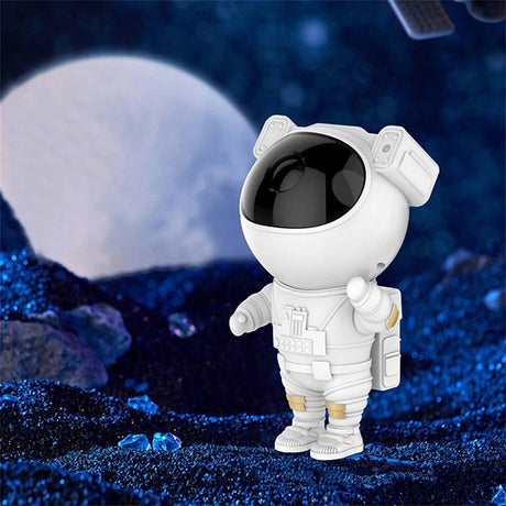 Astronaut galaxy projector displaying moon background lighting effect on ceiling.