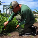 Person using the garden kneeler stool for comfortable kneeling while gardening outdoor beds.