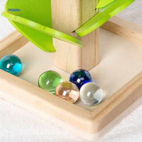 Mixed colorful glass beads included in wooden ball run toy set.