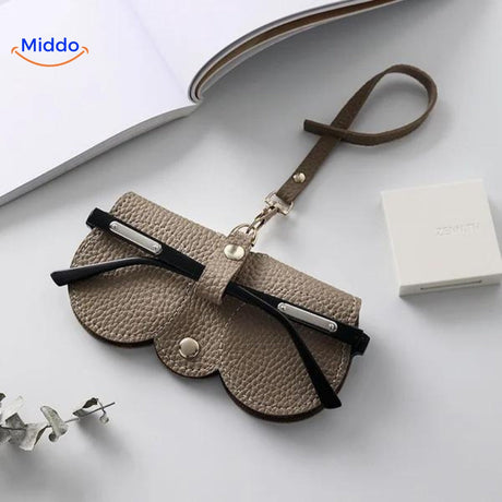 Slim leather glasses case in beige color for stylish eyewear protection.