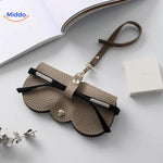 Slim leather glasses case in beige color for stylish eyewear protection.