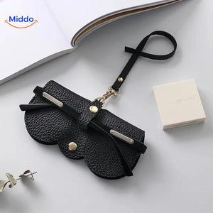 Slim leather glasses case in black offering classic eyewear protection and storage.