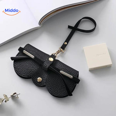 Slim leather glasses case in black offering classic eyewear protection and storage.