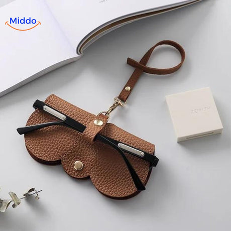 Slim leather glasses case in brown color offering durable eyewear protection.