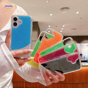 GlowSand phone cases in hand showing bright liquid color mix and glow effect.