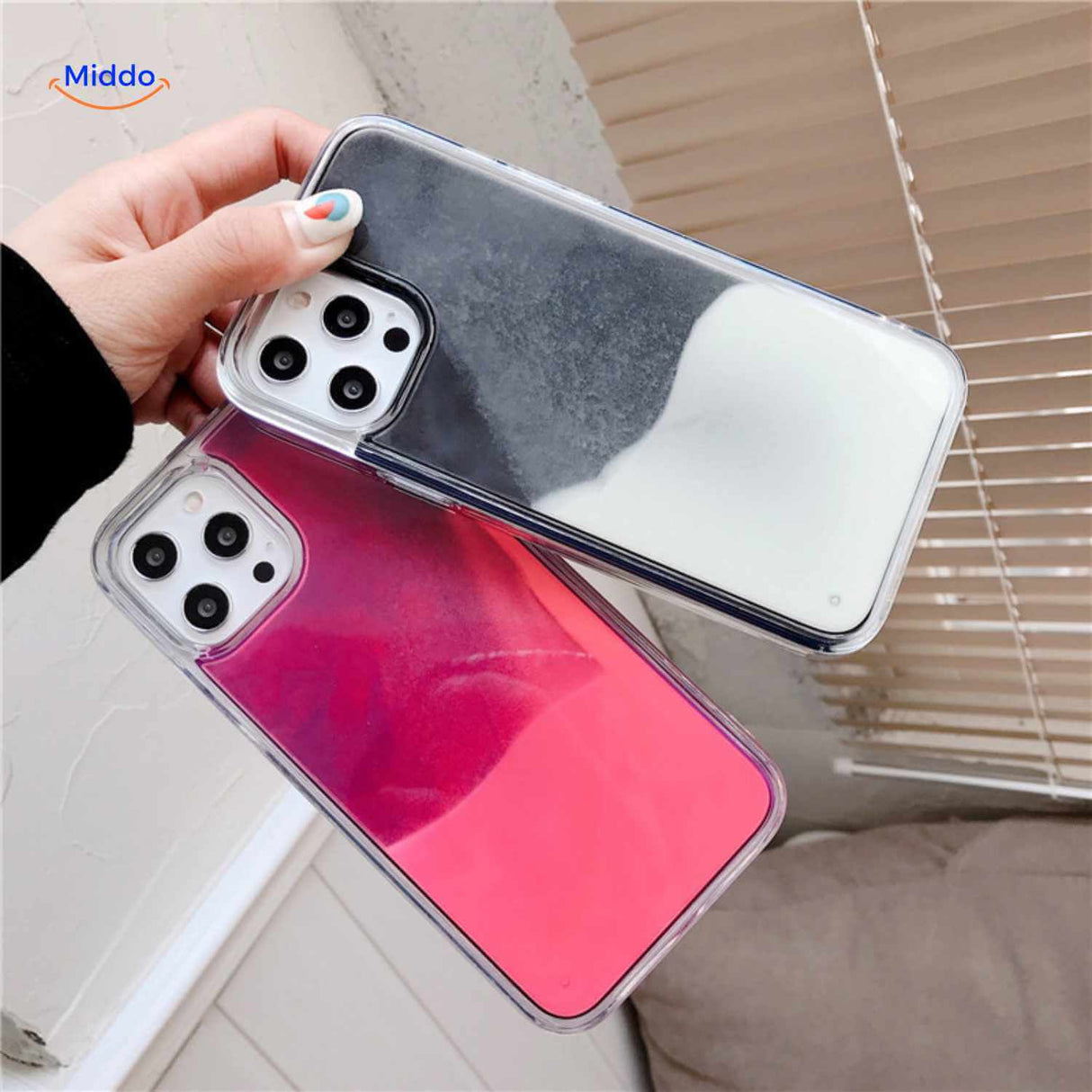 GlowSand phone case held in hand with black white and pink liquid effect.