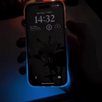 GlowSand phone case glowing in dark with LED-inspired luminous liquid effect.