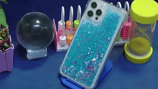 GlowSand phone case blue and pink glitter liquid sand arrangement display.