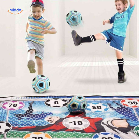 Kids practicing soccer shooting with GoalPlay game indoors.