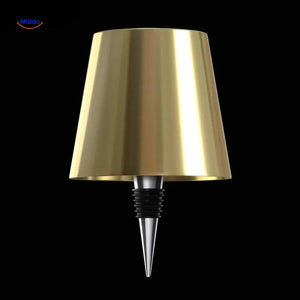 Gold rechargeable bottle lamp adding warm luxury lighting to spaces.