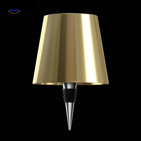 Gold rechargeable bottle lamp adding warm luxury lighting to spaces.