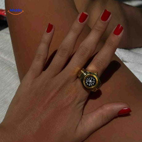 Gold stylish ring watch displayed on hand with polished finish.