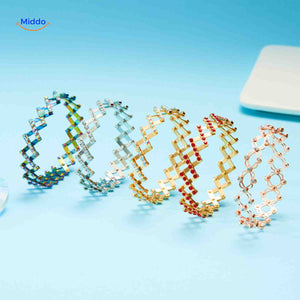 Gold wide adjustable ring with red crystal rhinestone embellishments.