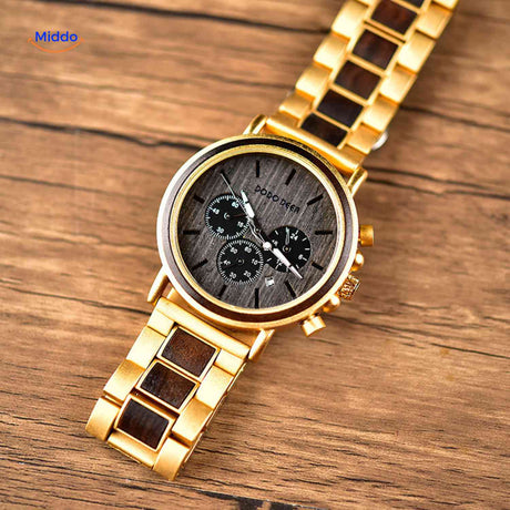 Golden wooden chronograph watch displayed on wooden surface.