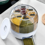 Top-down view of rotating grain dispenser filled with beans, seeds, and rice.