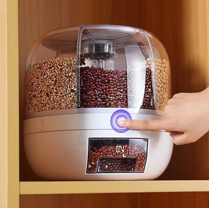 White rotating grain dispenser installed in kitchen cabinet with brown beans selected.