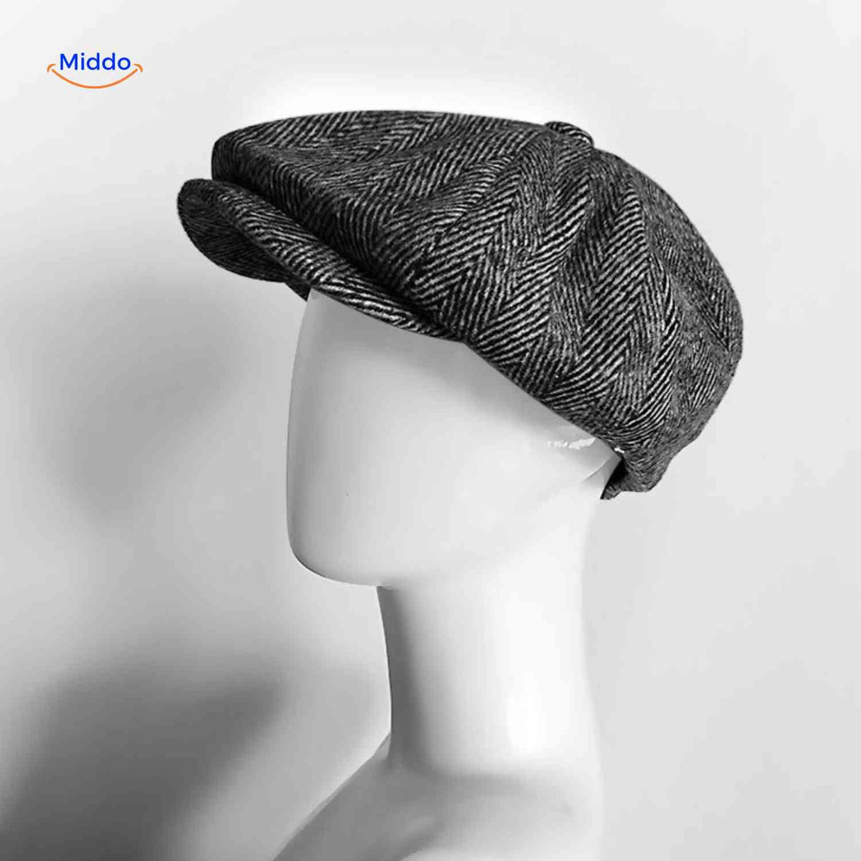 Gray herringbone wool newsboy cap with classic vintage design.