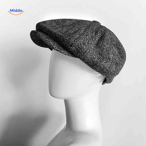 Gray herringbone wool newsboy cap with classic vintage design.