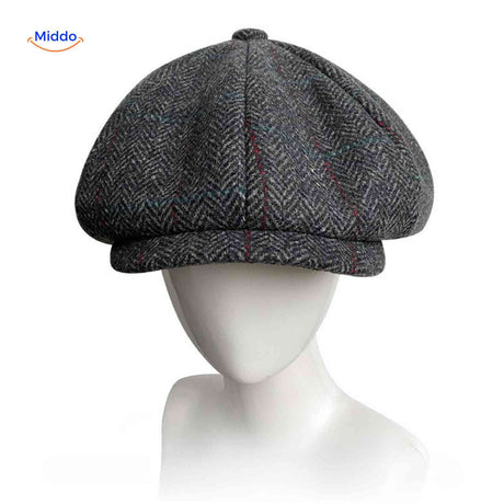 Gray herringbone wool newsboy cap with comfortable all-season fit.