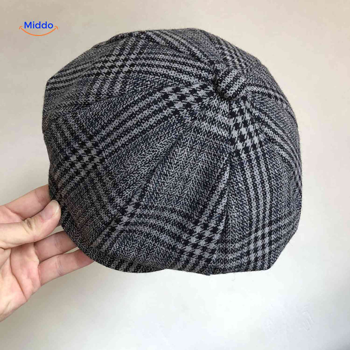 Gray herringbone wool flat cap with heritage vintage newsboy style.