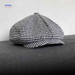 Gray houndstooth wool flat cap with timeless vintage heritage design.