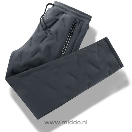 Flat lay view of gray waterproof thermo pants with fleece lining.