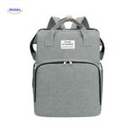 Gray trendy diaper backpack with foldable bassinet and practical organization.