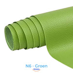 Green self-adhesive leather patch for green-toned furniture restoration.