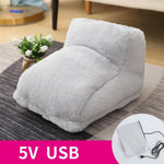 Grey heated foot warmer showing USB connection port.