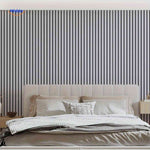 Grey wood-look slat wall panels mounted as a bedroom headboard accent wall.