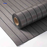 Close-up of grey wood-grain 3D wall panel roll revealing textured slat detail.