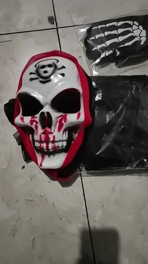 Grim reaper costume set combining skull mask, glowing gloves, and black cape.