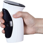 Hand grip trainer held in hand, displaying ergonomic grip and compact design.