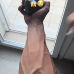 Hand grip strengthening exercise using GripFlex trainer with resistance massage ball.