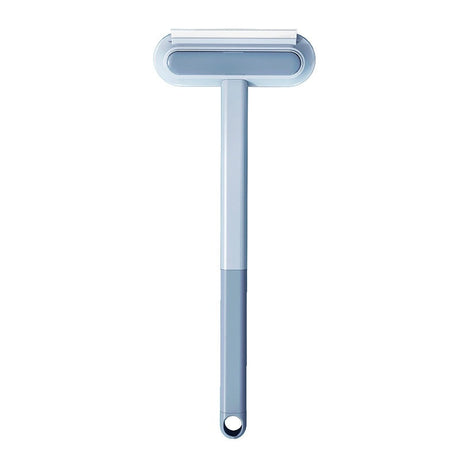 Pet hair remover brush with ergonomic gray handle for comfortable furniture cleaning.