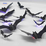 LED bat light positioned on surface for Halloween decoration.