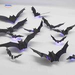 LED bat lamp display on table for Halloween decoration setup.