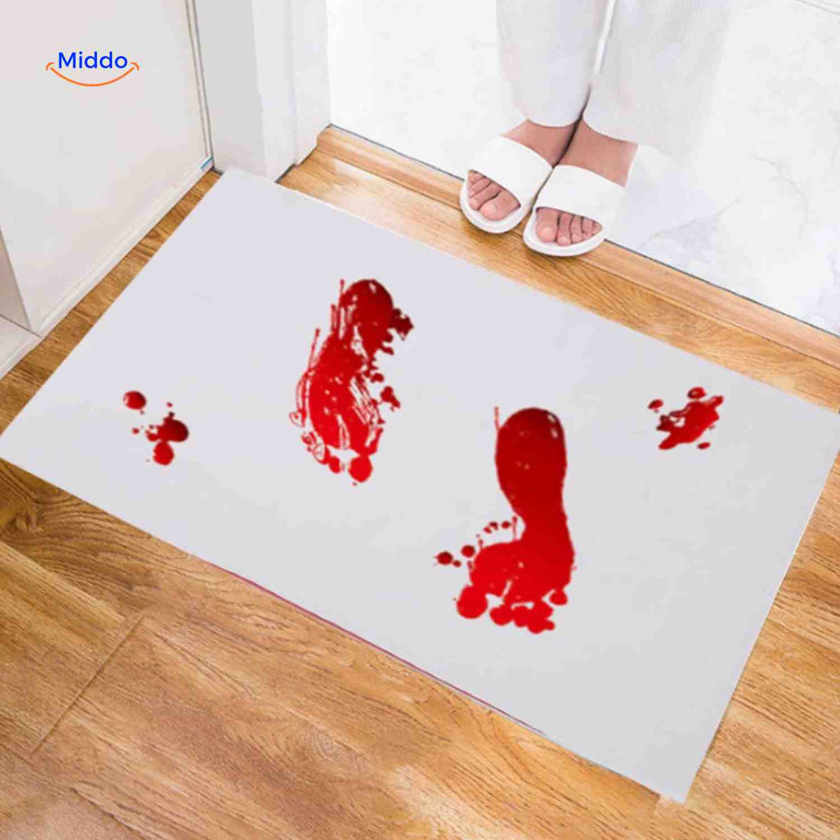 Halloween bath mat with dramatic bloody footprint trail design.