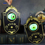 Halloween gadget doorbell with lighted green eye effect