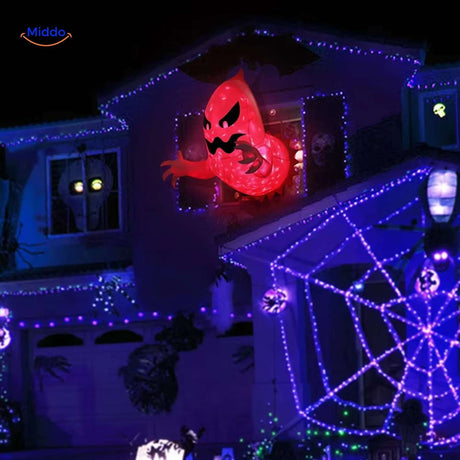 House decorated with glowing inflatable ghost creating spooky festive atmosphere.