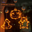 Halloween LED window lamps showing pumpkin, witch hat, and ghost shapes hung as window decoration.