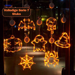 Complete set of 7 Halloween LED window lamps with assorted spooky shapes for full window display.