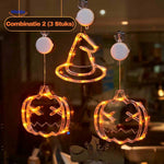 Halloween LED window lamp set featuring pumpkin and witch hat shapes glowing in warm orange light.