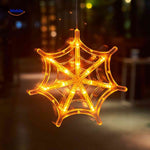 Halloween LED window lamp in a spiderweb shape, glowing orange for atmospheric Halloween decor.