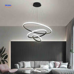 Black halo ring dimmable LED chandelier in minimalist living room interior design.